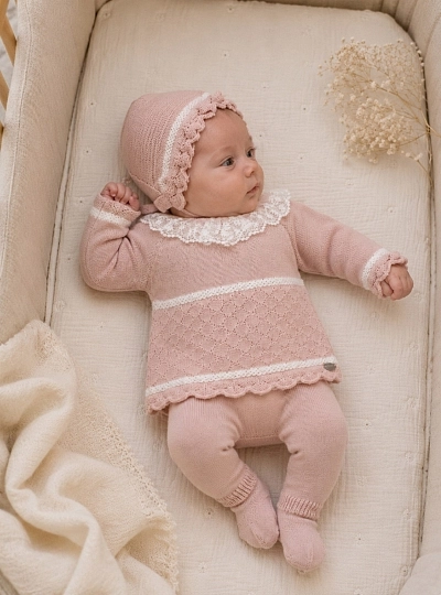 Baby girl's knitted outfit with bonnet and pale pink leggings Baby girl's knitted outfit with bonnet and pale pink leggings