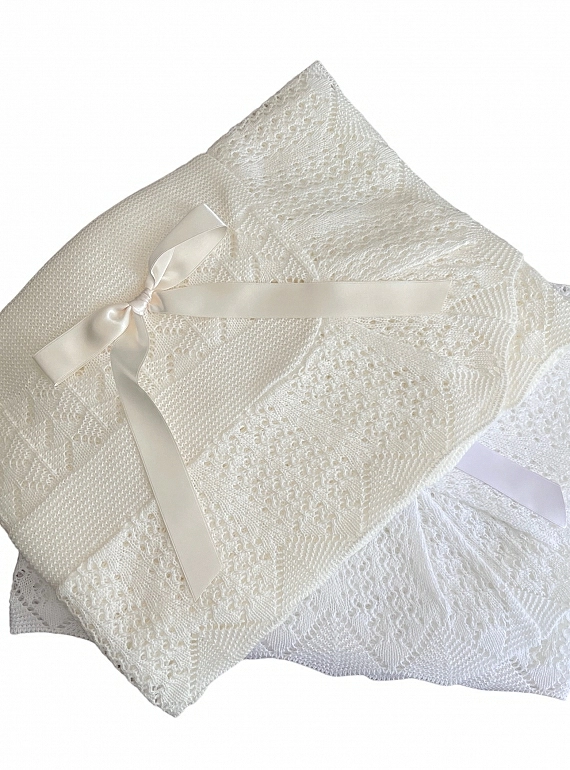 Beige or white winter knit shawl.
