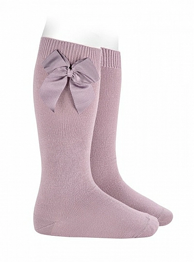 Condor brand knee-high socks or tights, plain knit, with bow. Color 130 Mother of Pearl. Condor brand knee-high socks or tights, plain knit, with bow. Color 130 Mother of Pearl.