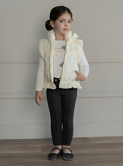 Cream-colored quilted vest for girls