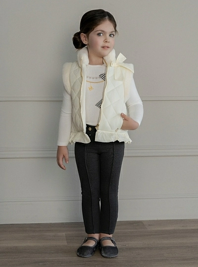 Cream-colored quilted vest for girls