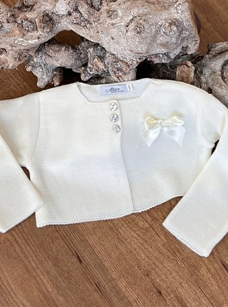 Girl's jacket in fine yarn, three colors with matching bow.