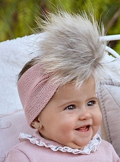 Knitted turban with fur pompom. two shades of pink