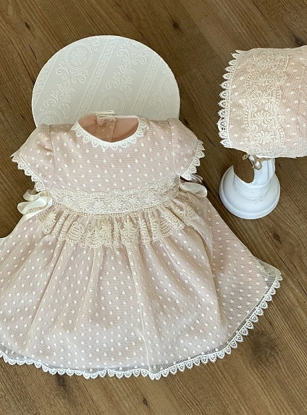 Pink and beige dress and bonnet set.