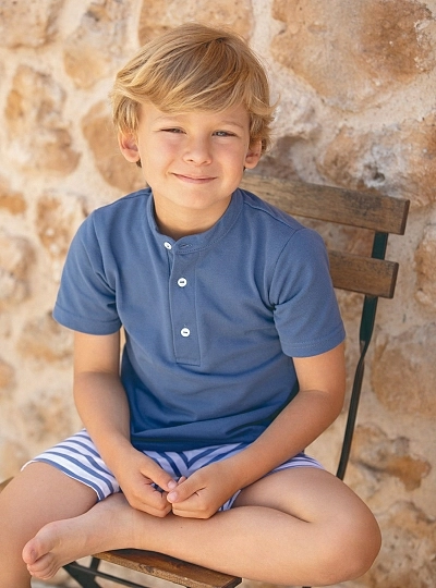 Set for boy. Blue polo shirt and striped pants.