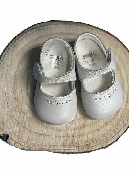 Shoe for a special christening girl. Pearly skin.