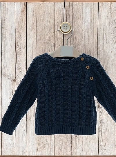Two-tone boy's sweater. Cable knit.